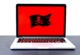 Malware Pirate Flag on Laptop Screen